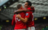 Wayne Rooney of Manchester United celebrates scoring to make it 1-1 with Robin van Persie during the Barclays Premier League match between Manchester United and Stoke City at Old Trafford on October 20, 2012 in Manchester, England. (Getty Images)